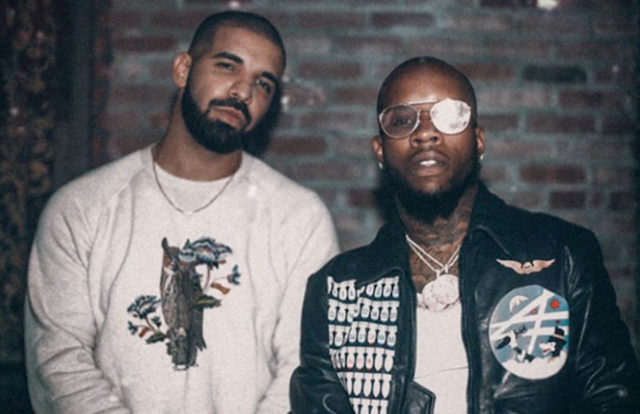 SPOTTED : Tory Lanez in the Yellow Signature Hoodie on the Drake Assassination Vacation Tour.